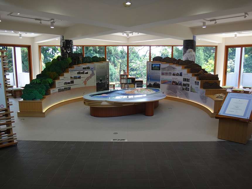 Inside the first floor exhibition room. Yakushima Island's vegetation model is shown on the left, with the mountain model on the right.
