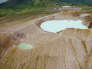 photo of Mt. Kusatsu-Shirane (Yugama Crater Lake and Surrounding Volcanic Desert)