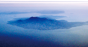 photo of Shimabara Peninsula with Rising Mt. Unzen (front) and the Amakusa Islands (back)